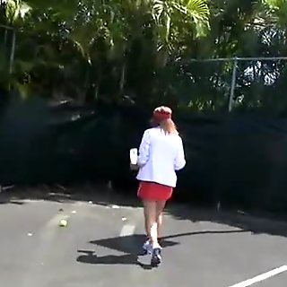 College teens stop playing tennis for a hazing session with toys